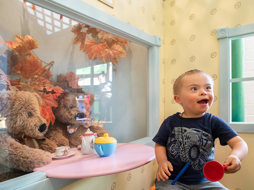 A little boy plays with toys at the Children's Museum of Sonoma County