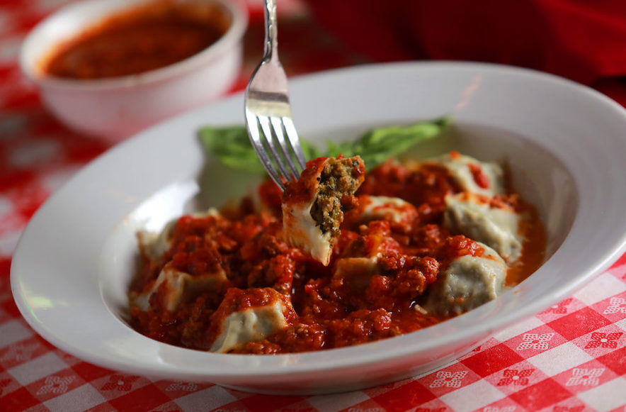 Traditional Italian pasta dinner served on a red-and-white checked tablecloth at Negri's in Occidental 