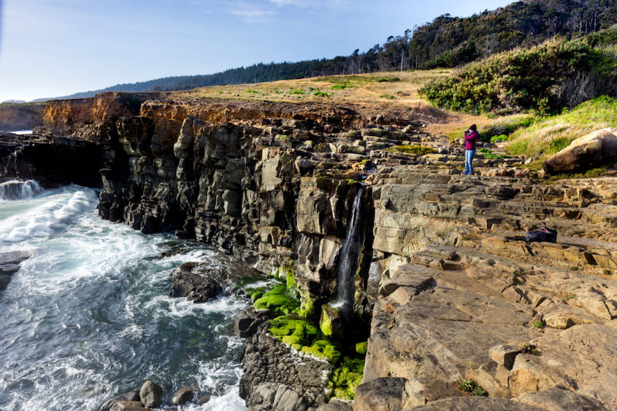 To the north, when the rains are right, there’s a stunning coastal waterfall at Phillips Gulch. (Leslie Wells/Shutterstock)