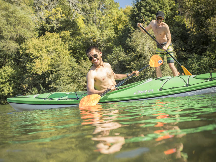 Two guys on kayaks in the Russian River.