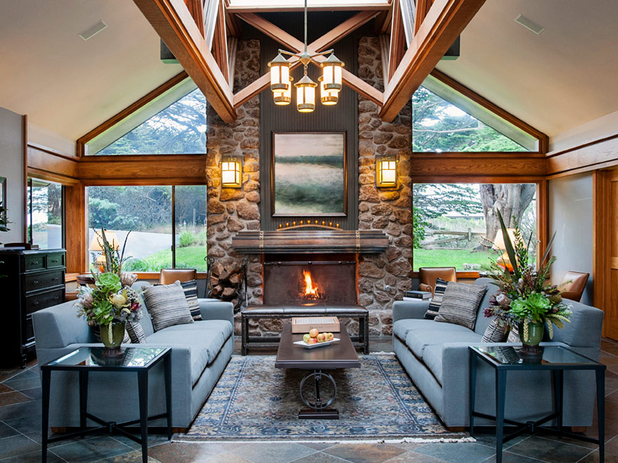 Couches and a cozy fireplace inside Bodega Bay Lodge