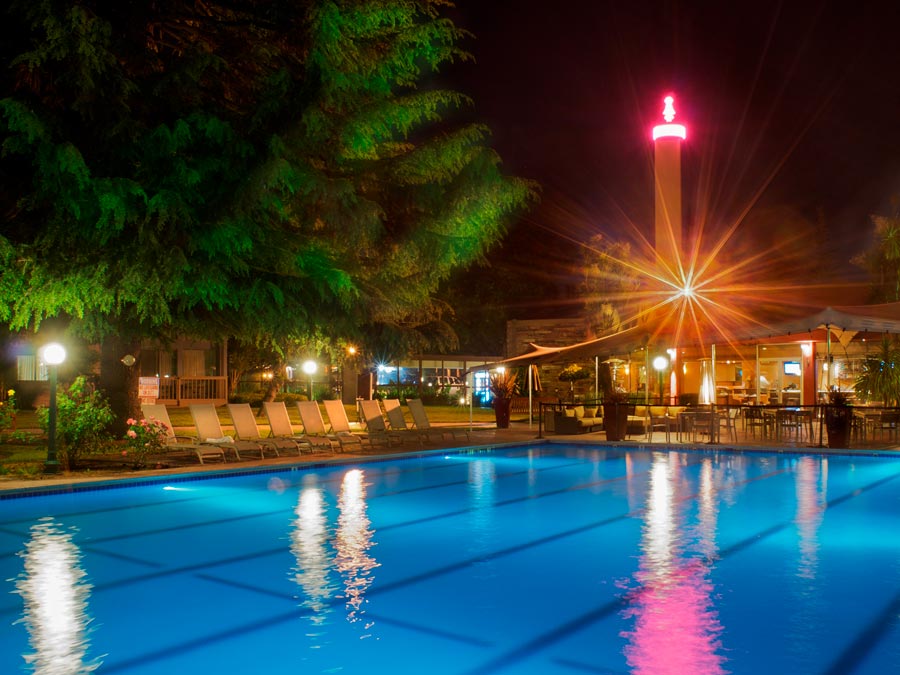 The pool is illuminated at night the the neon sign at the Flamingo Conference Resort and Spa, Santa Rosa