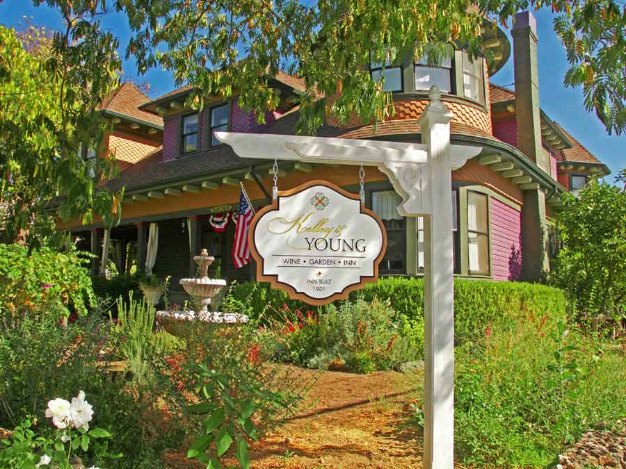 The sign and gardens in front of the Kelley & Young Wine Garden Inn, Cloverdale