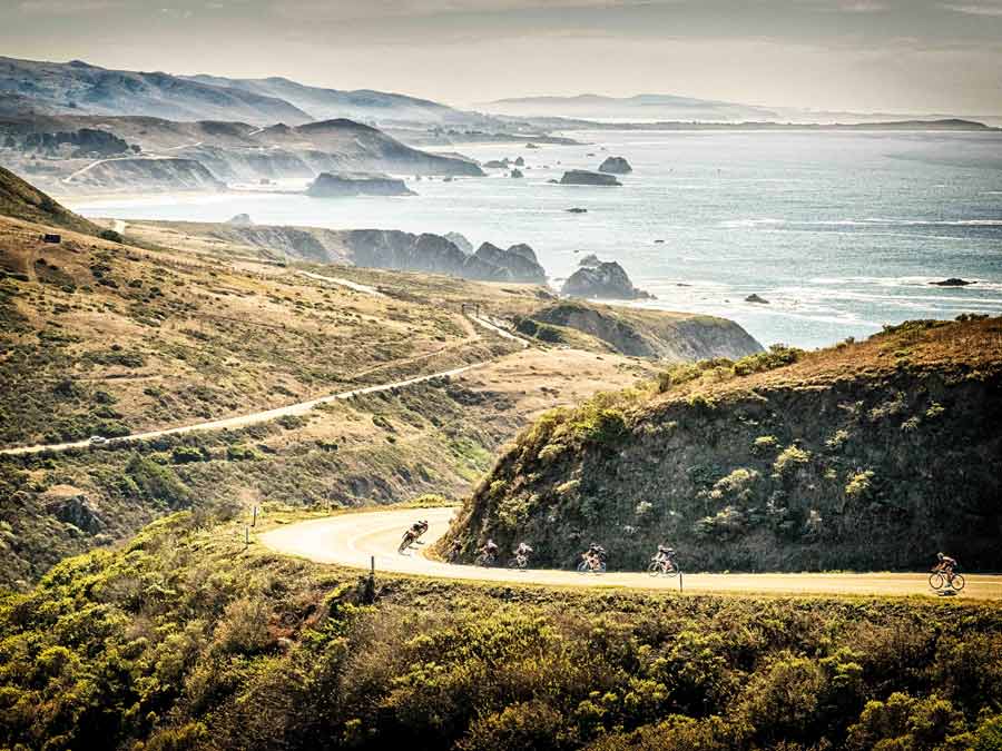 People cycle toward the coast at Jenner, Sonoma County