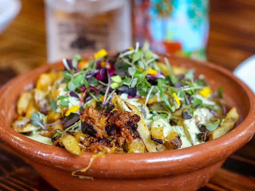 bodega bowl with greens and potatoes