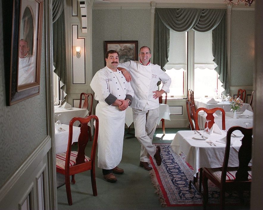 Former Chef de cuisine Todd Muir (right) leans on the shoulder of Chris Mazotti inside one of the Madrona Manor's elegant dining rooms in 1999. (Chad Surmick)