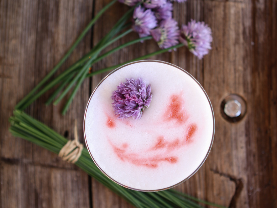 A cocktail dotted with fresh herbs on top at Barndiva in Sonoma County