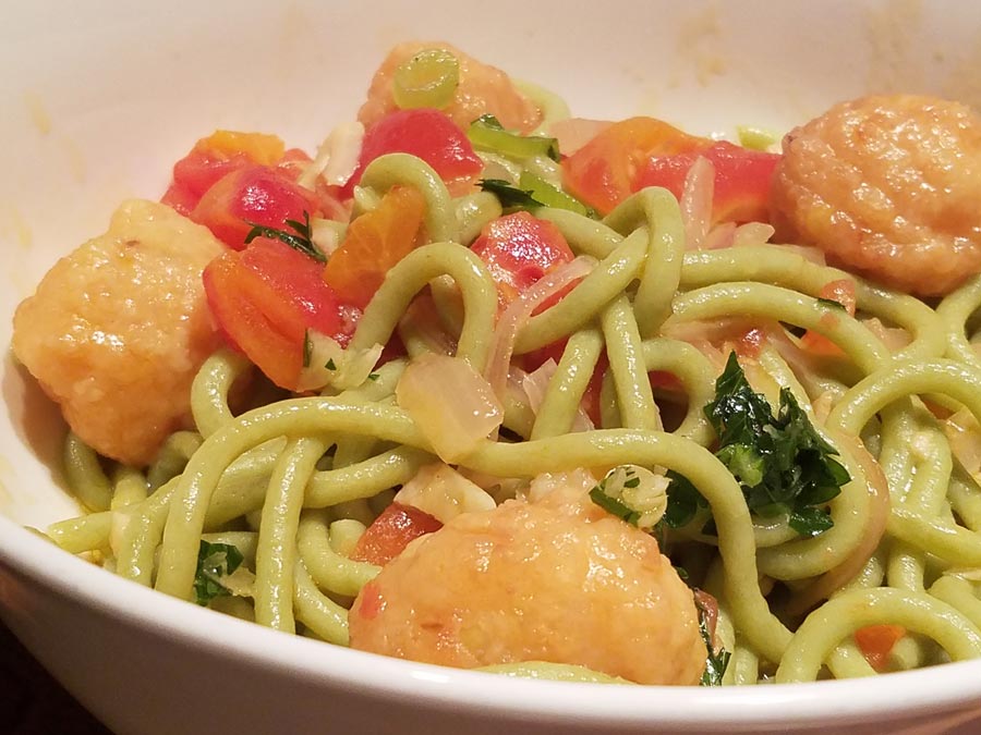 A pasta dish with fresh, spring vegetables