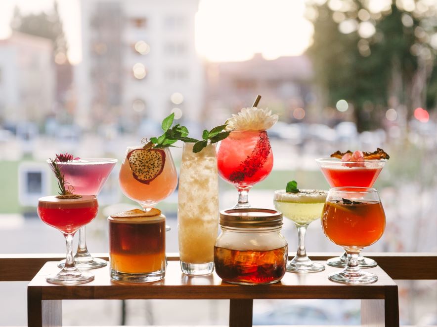 Picture of cocktails lined up at Perch + Plow cocktail bar