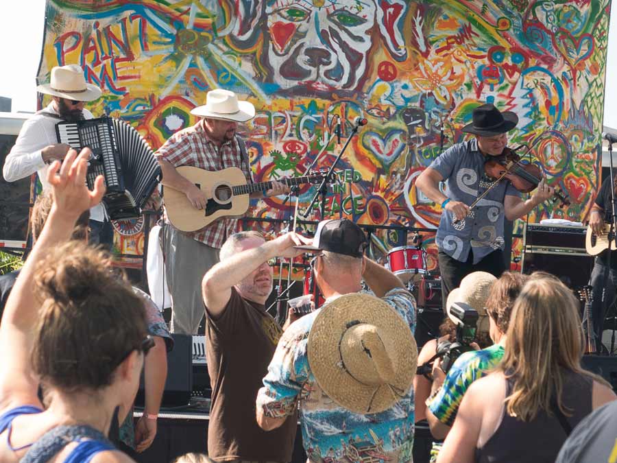 People to the music of a band on the stage at the Petaluma Music Festival, Sonoma County