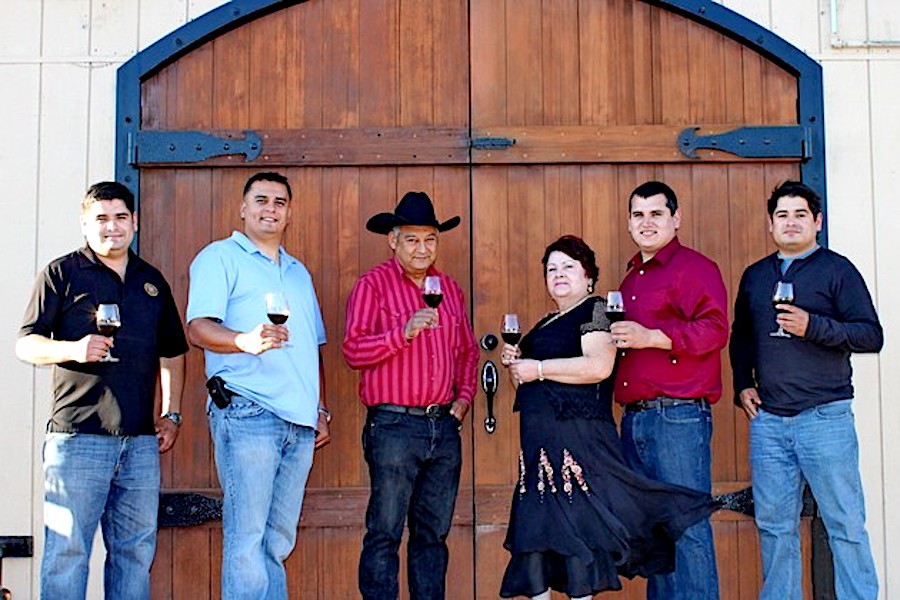 Reynaldo, Sr. and Maria Robledo (center) with some of their nine children 