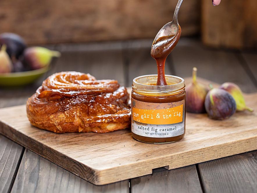 caramel in jar and sticky bun in background