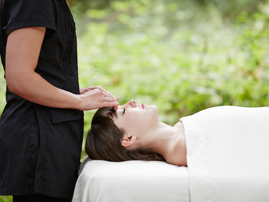 Woman receiving a massage at Osmosis Spa in Sonoma County