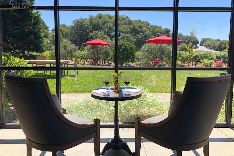 Inside the tasting room at Mauritson Wines in Healdsburg, beside a window with a view of the tasting lawn