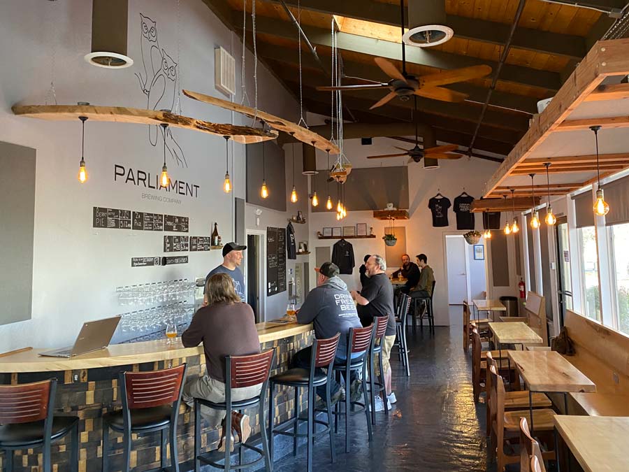 The interior of the tasting room has very high ceilings