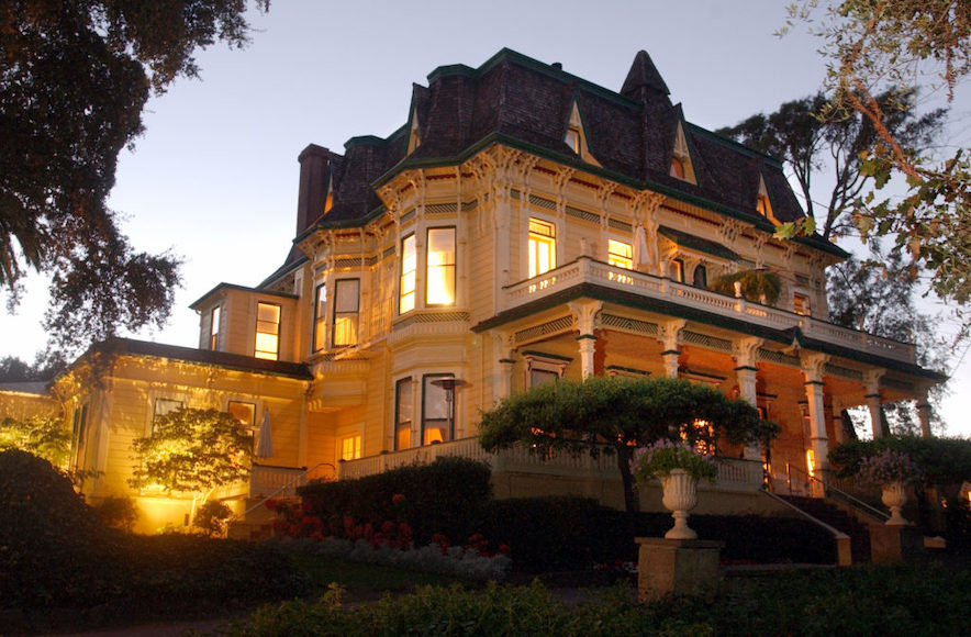 Exterior of Madrona Manor at dusk, with interior lights lit 