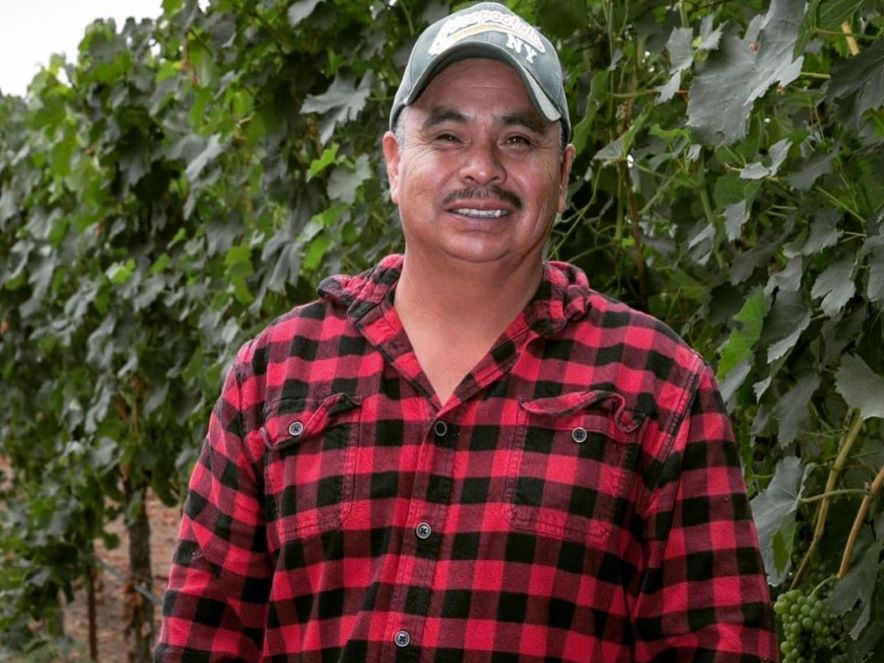 Picture of winegrower Jose Cervantes standing in vineyard