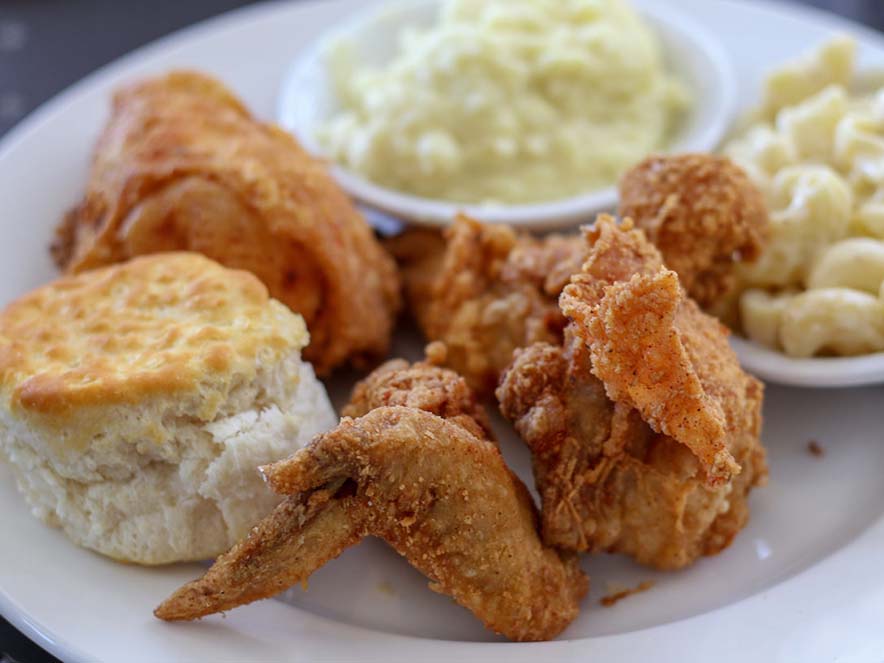 fried chicken and macaroni and cheese on white plate