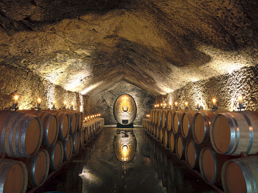 The interior of the wine againg caves with barrels