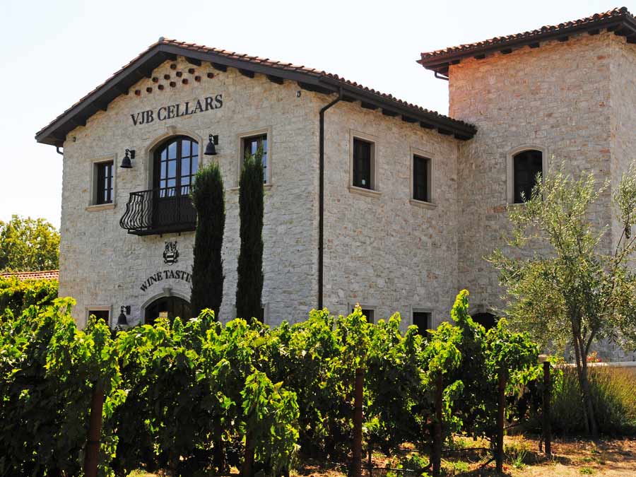 The stone winery is surrounded by vineyards