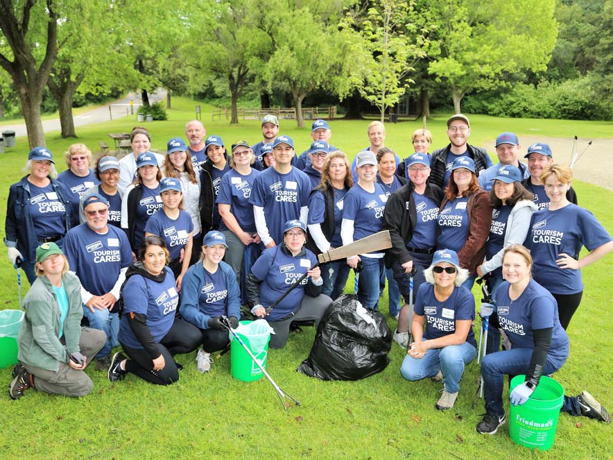 Image of Toursim Cares volunteers posing a group photo at Spring Lake Park.