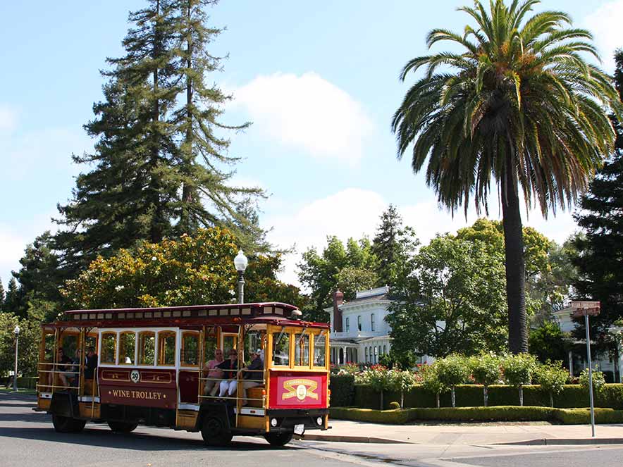 The Sonoma Valley Wine Trolley turns a corner in the town of Sonoma