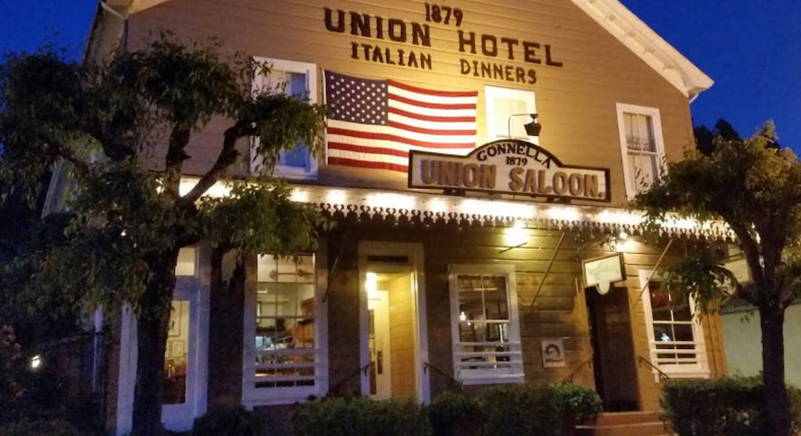 Exterior of the Union Hotel in Occidental, lit up at night