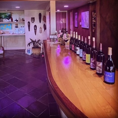 Image of Woodenhead Wines lit in pinot purple