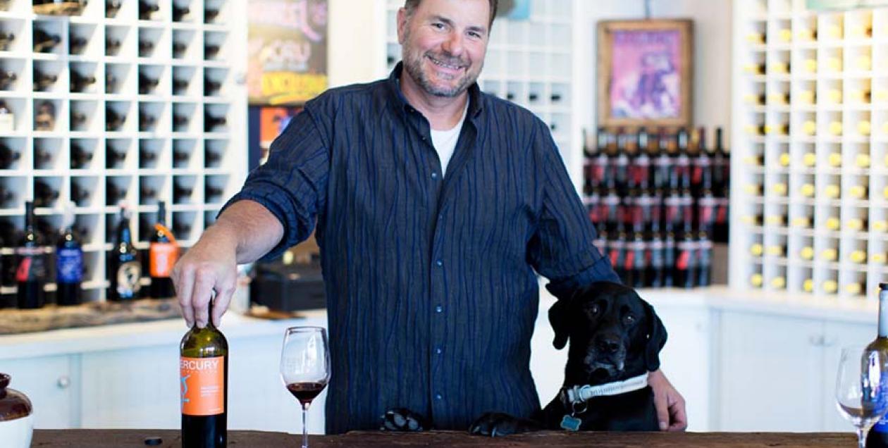 Winemaker Brad Beard and his black labrador, Freddie, in the Mercury Wine tasting room in Geyserville, California 