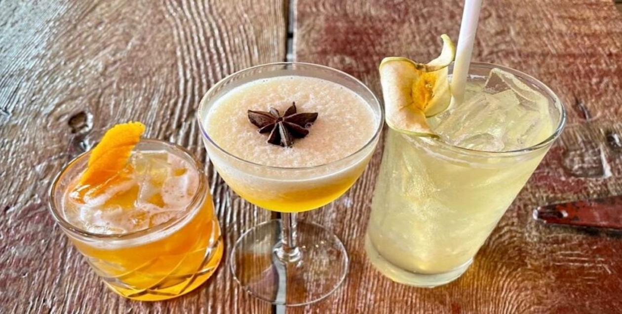 Trio of amber and golden autumn cocktails 