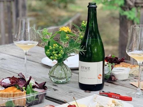 picnic with food and wine bottle on table